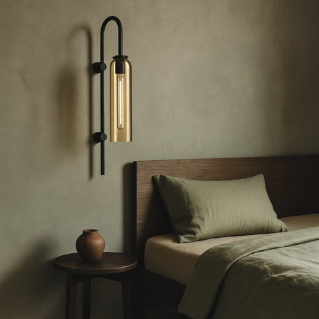 Bedroom with a Ampule wall lamp from Love Hohm, bed, and side table.