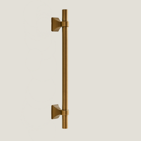 Ansel brass pull bars from Love Hohm on a beige background