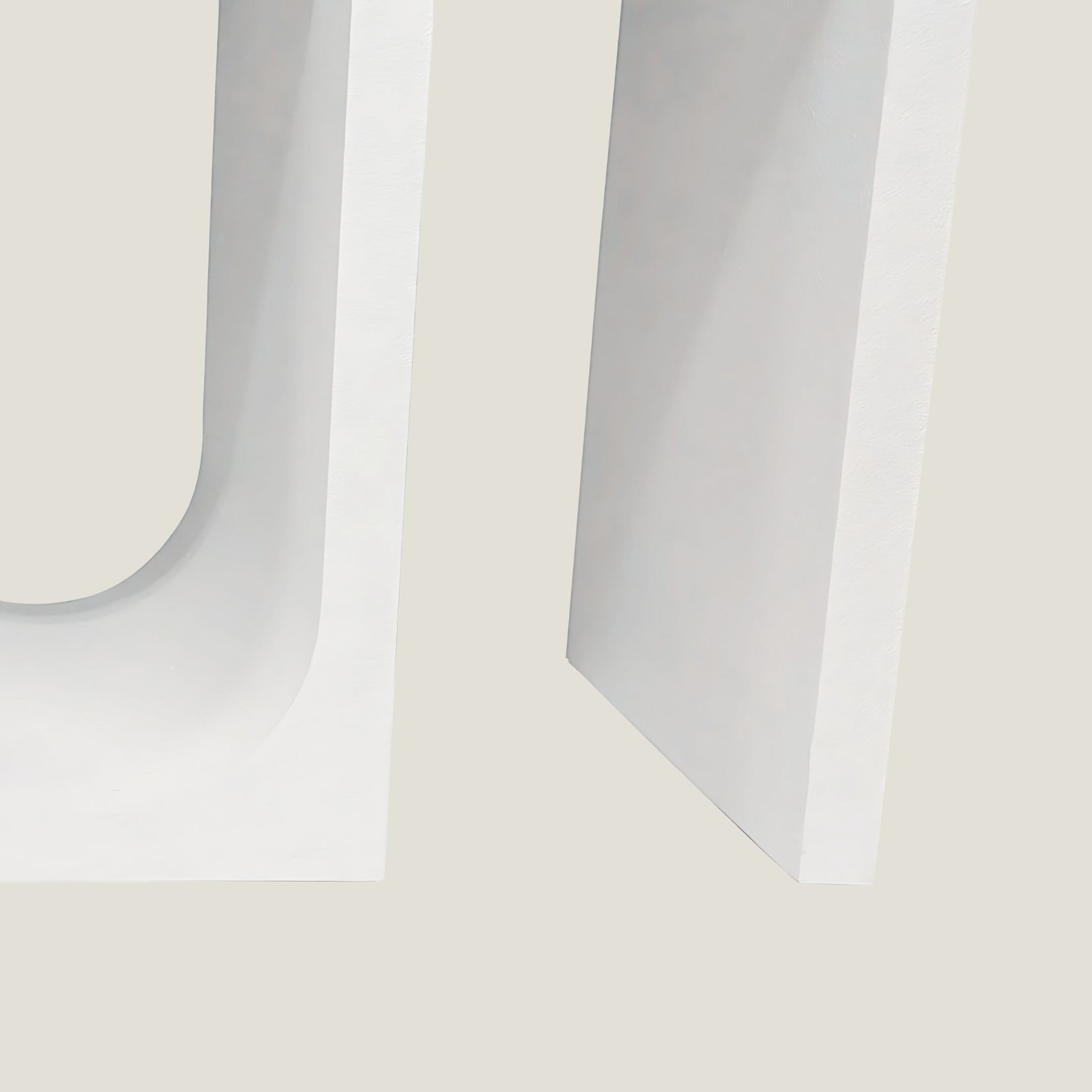 Close-up of an Archwell console table from Love Hohm on a light beige background