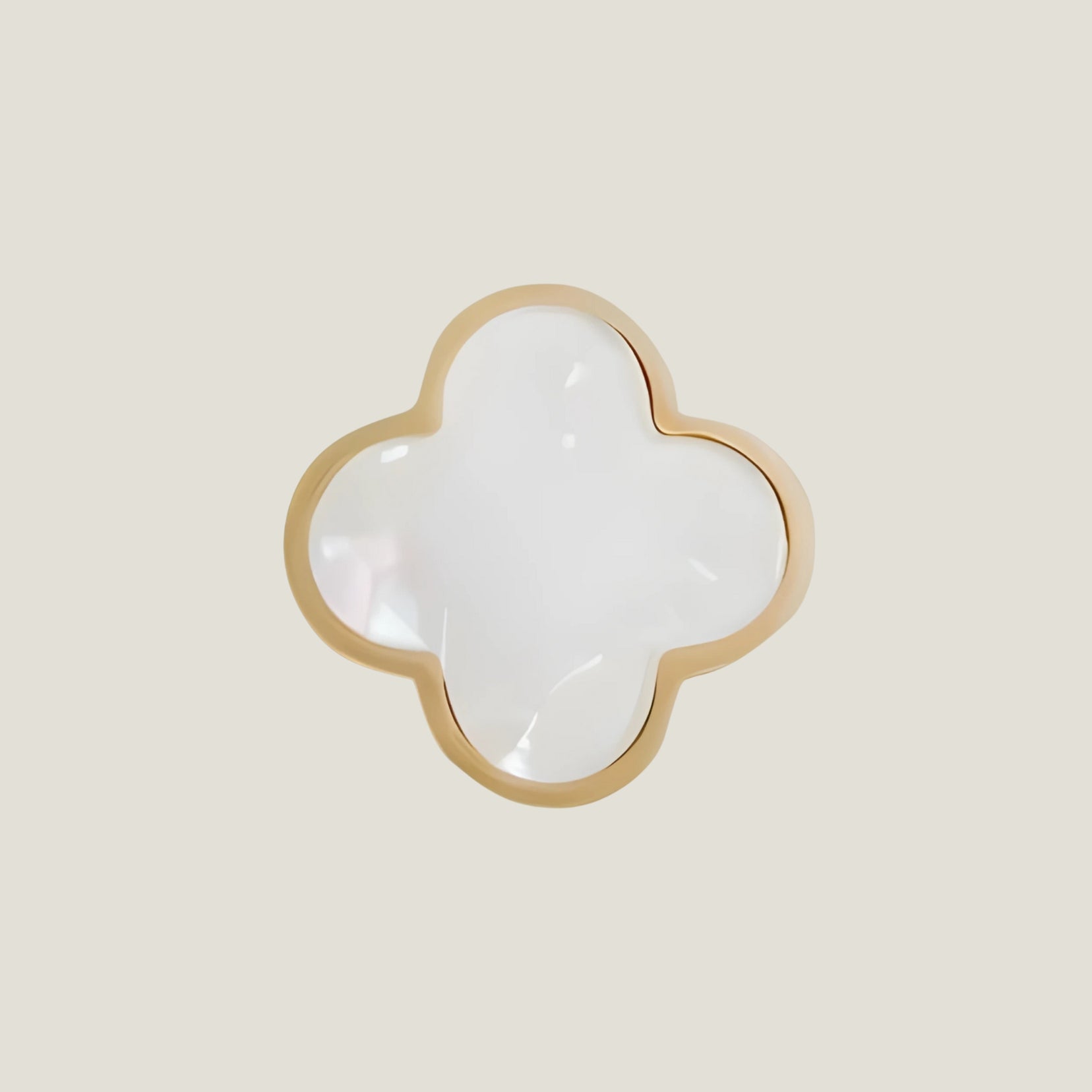 Charmant from Love Hohm with gold rim on a beige background