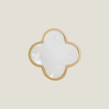 Charmant from Love Hohm with gold rim on a beige background