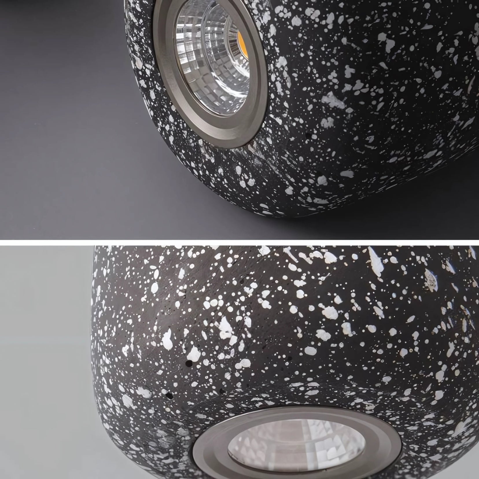 Speckled black and white lamp with visible light bulb on a gray background