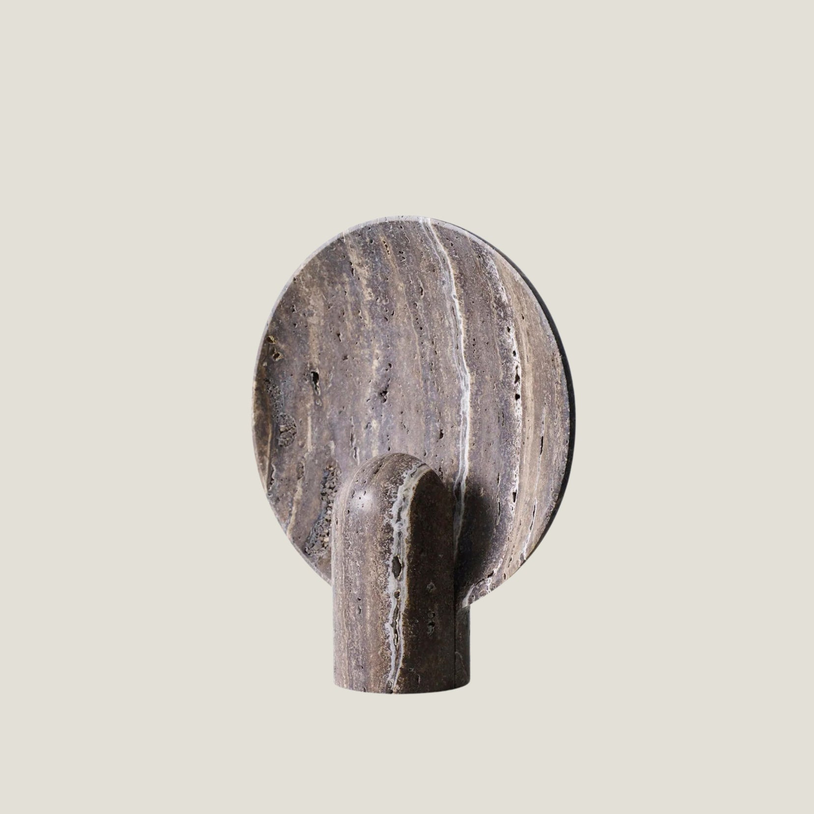 Fosse travertine table lamp from Love Hohm on a beige background