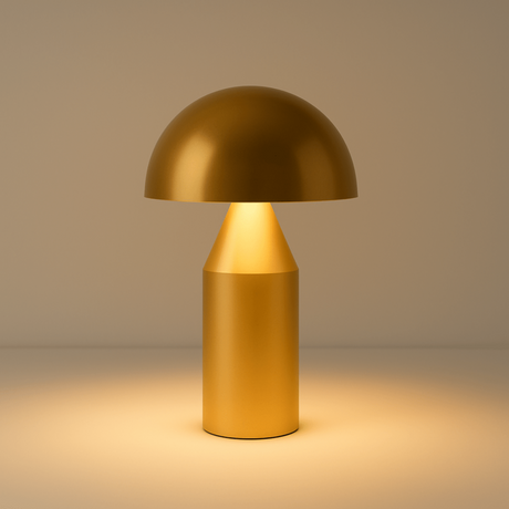 Gold table lamp with a warm glow on a beige background