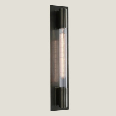 Gilt brass wall lamp from Love Hohm on a beige background