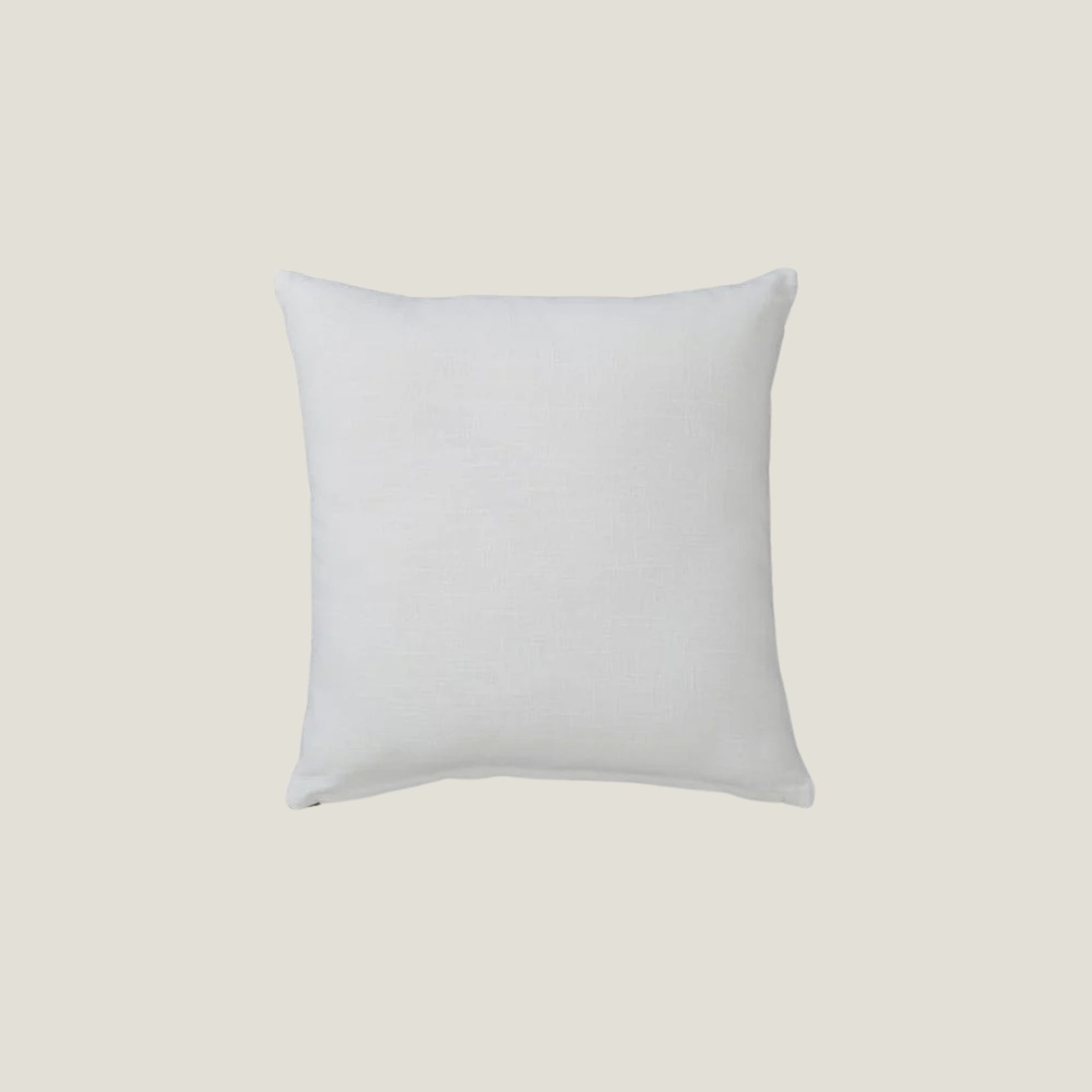 Back side of a Glyph accent pillow from Love Hohm on a light beige background