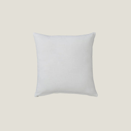 Back side of a Glyph accent pillow from Love Hohm on a light beige background