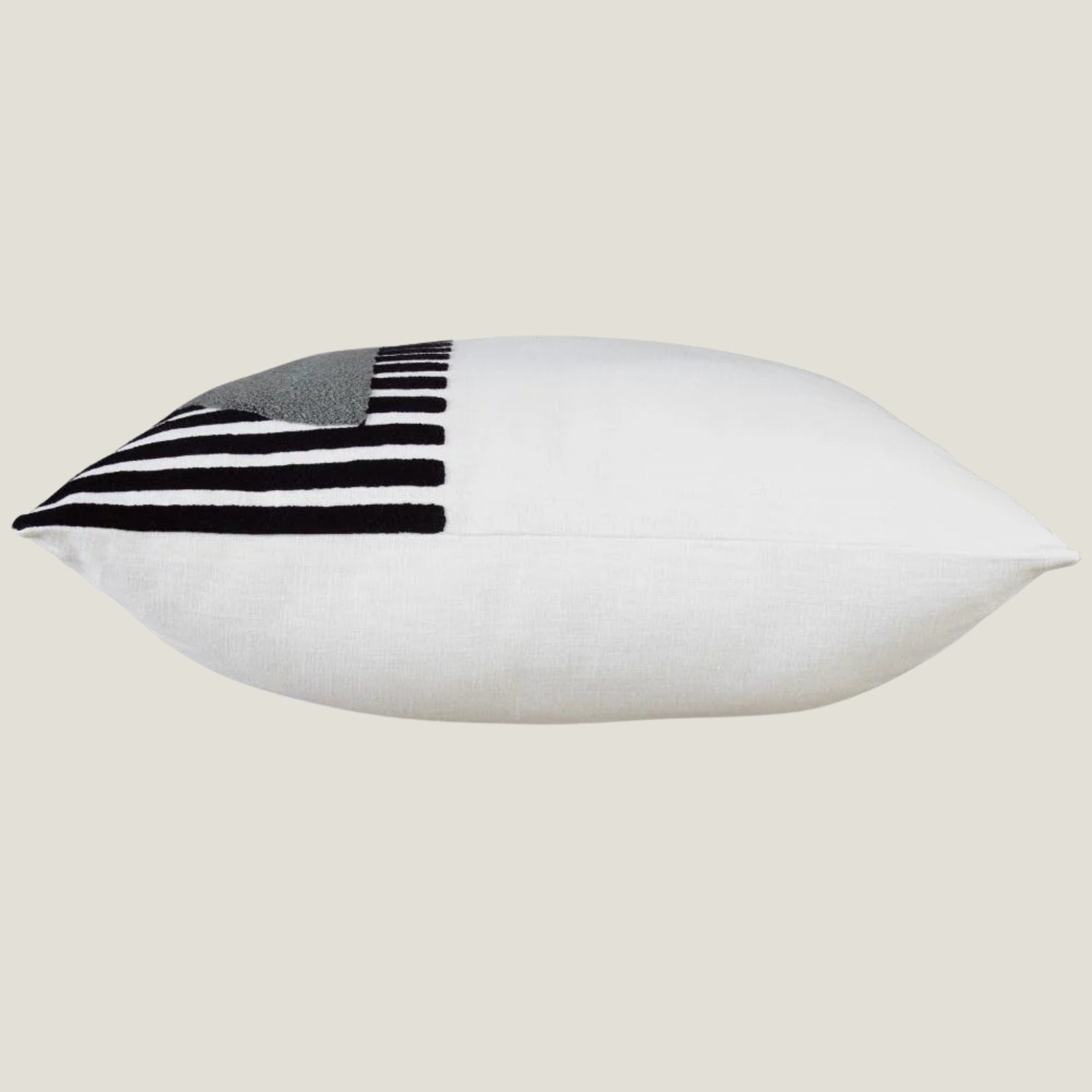 Glyph decorative pillow from Love Hohm with black and gray striped pattern on a beige background