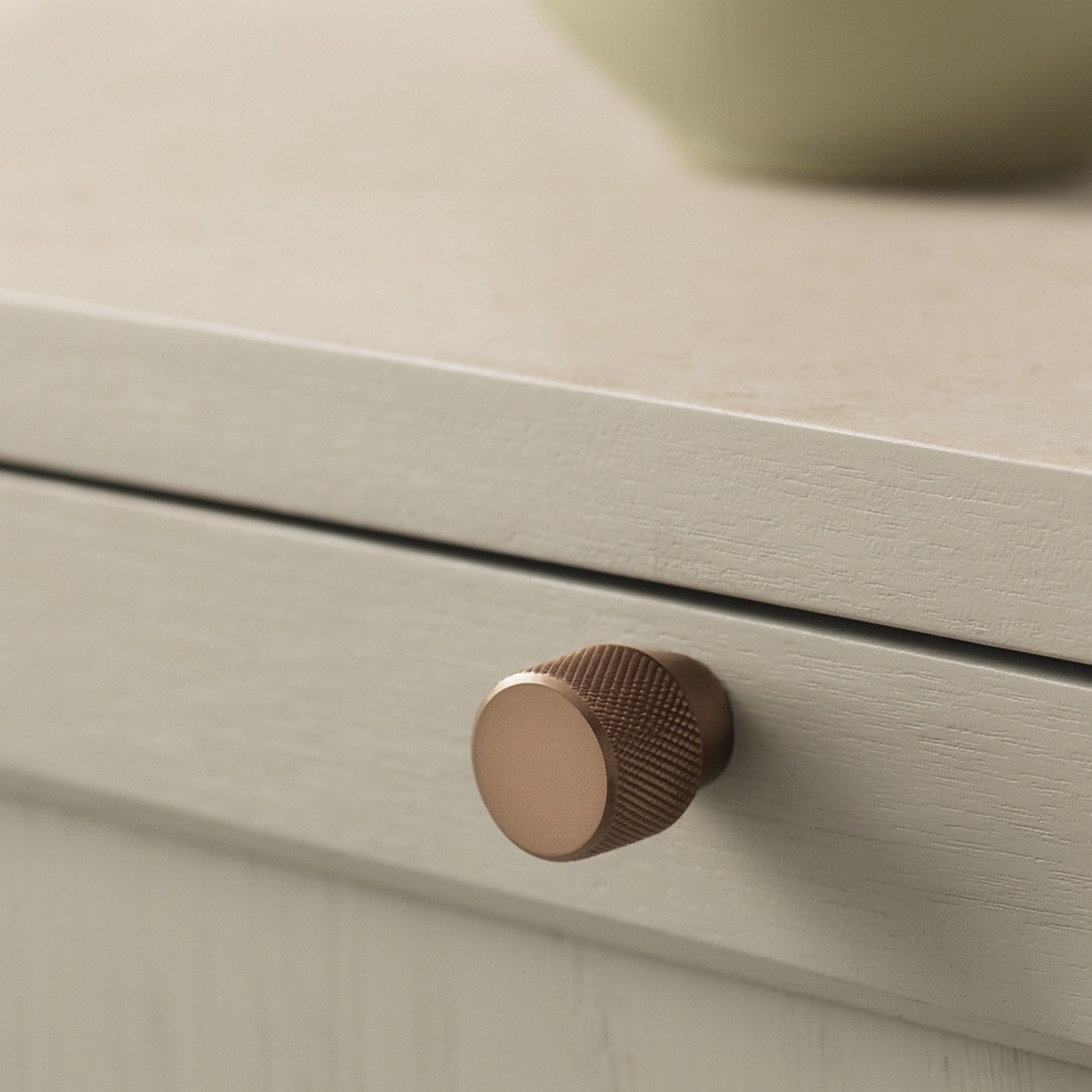 Close-up of Grain knob by Love Hohm on a light wooden drawer