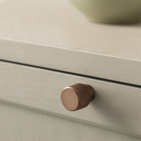 Close-up of Grain knob by Love Hohm on a light wooden drawer