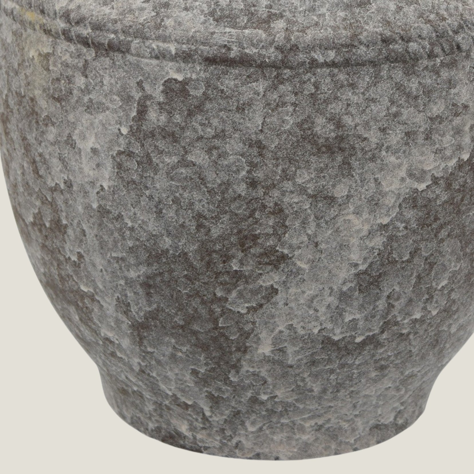 Close-up of a Granate ceramic vase from Love Hohm on a light beige background