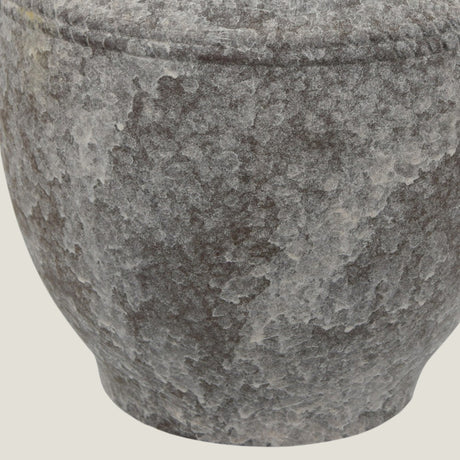 Close-up of a Granate ceramic vase from Love Hohm on a light beige background