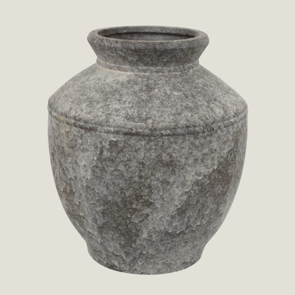 Granate gray ceramic vase from Love Hohm on a light gray background