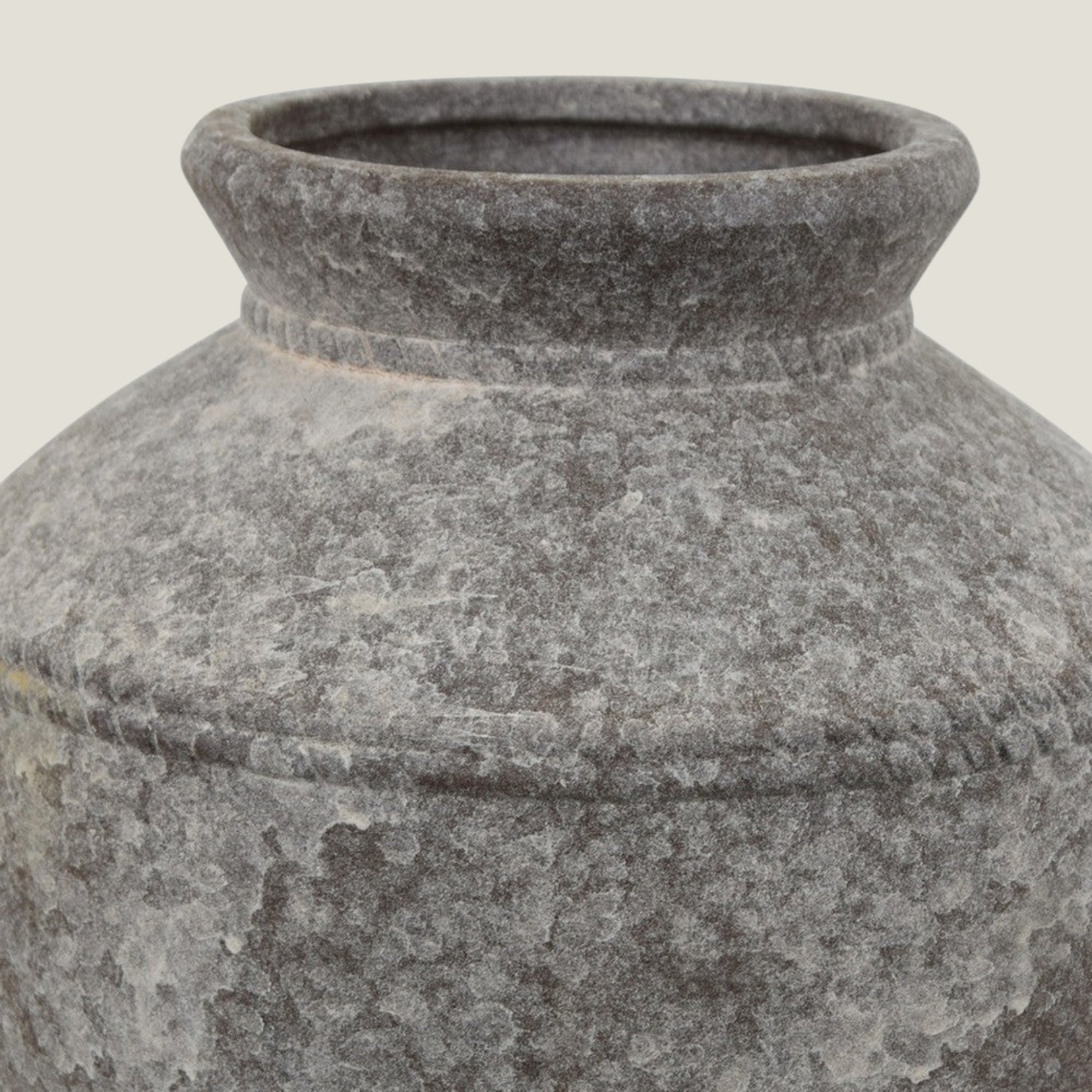 Close-up of a Granate sculptural vase from Love Hohm on a light gray background