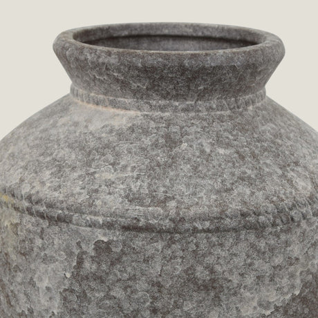 Close-up of a Granate sculptural vase from Love Hohm on a light gray background