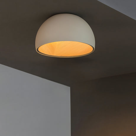 Haven ceiling lamp from Love Hohm with a warm glow on a dark ceiling