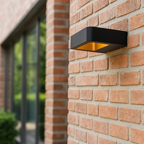 Ledger outdoor wall lamp from Love Hohm on a brick wall