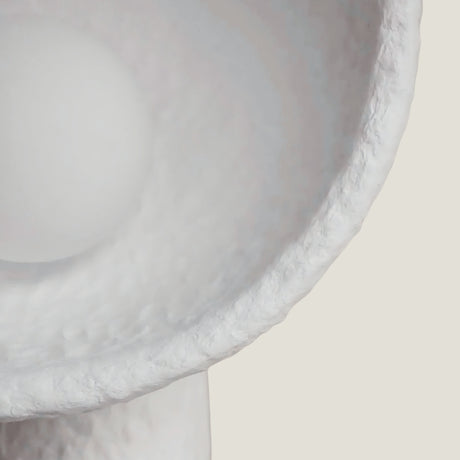 Close-up of a textured white Lodestar Big Floor Lamp from Love Hohm on a light background