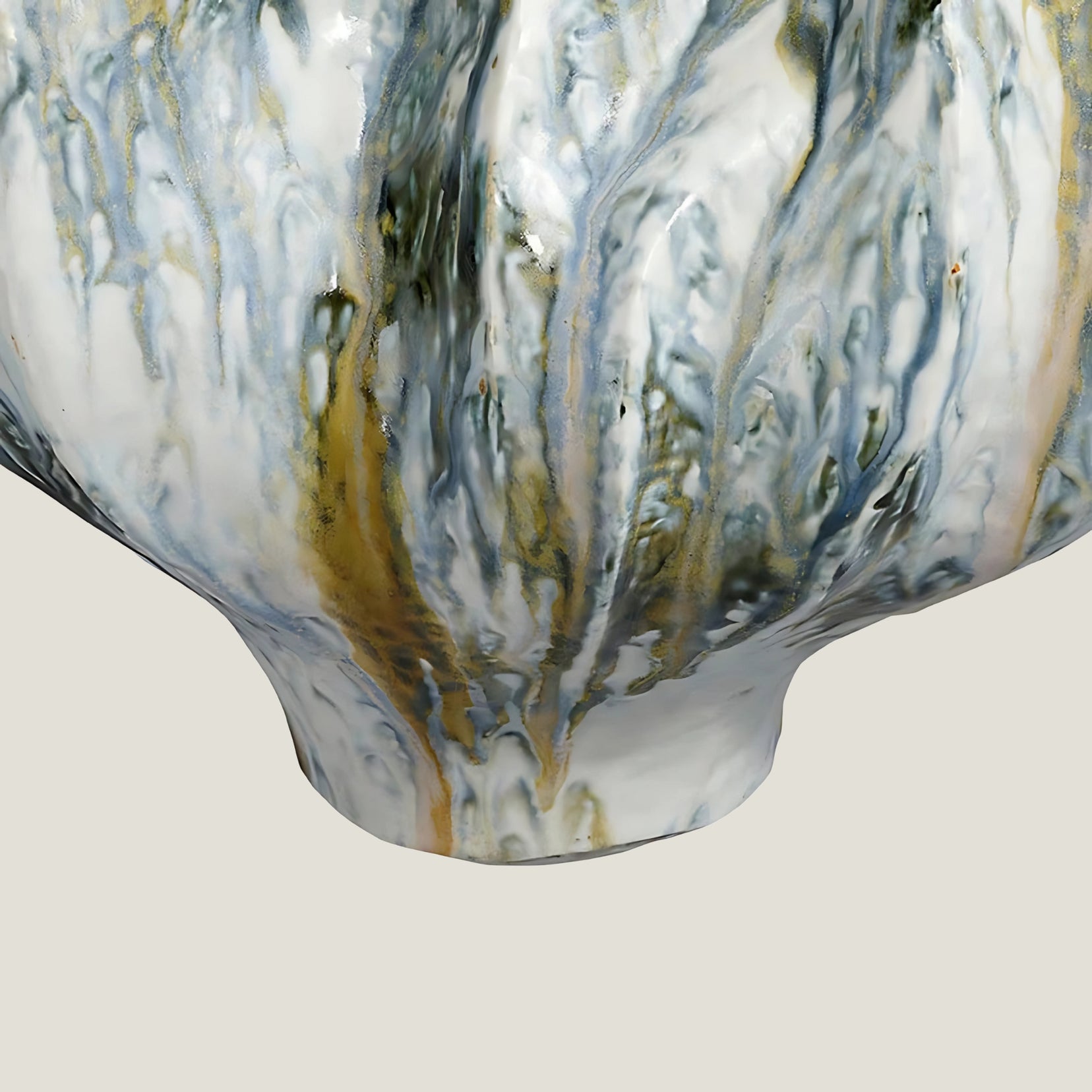Marrow ceramic vase from Love Hohm  with white, blue, and gold colors on a light gray background