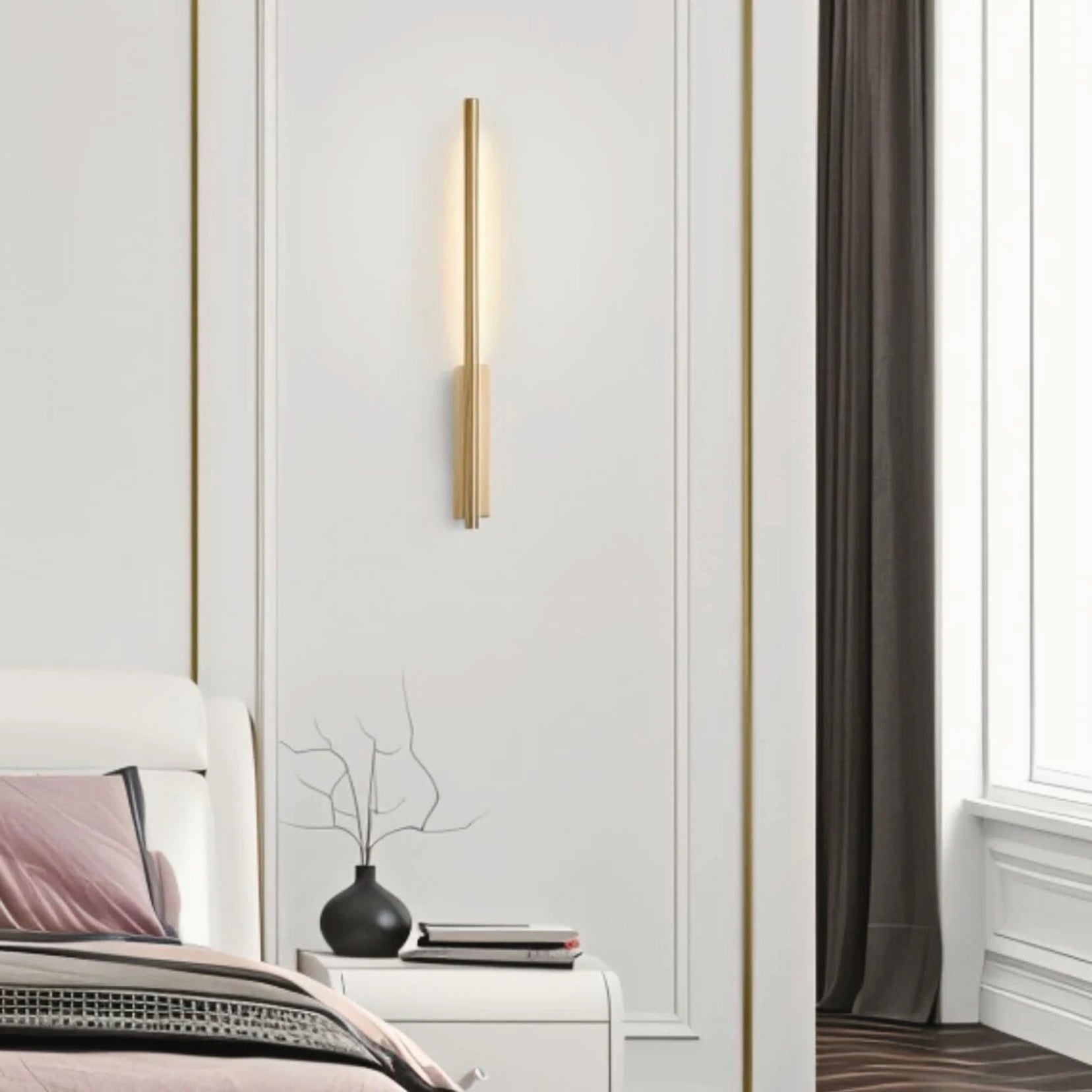 Northcut wall lamp from Love Hohm in a bedroom setting with a bed and window.