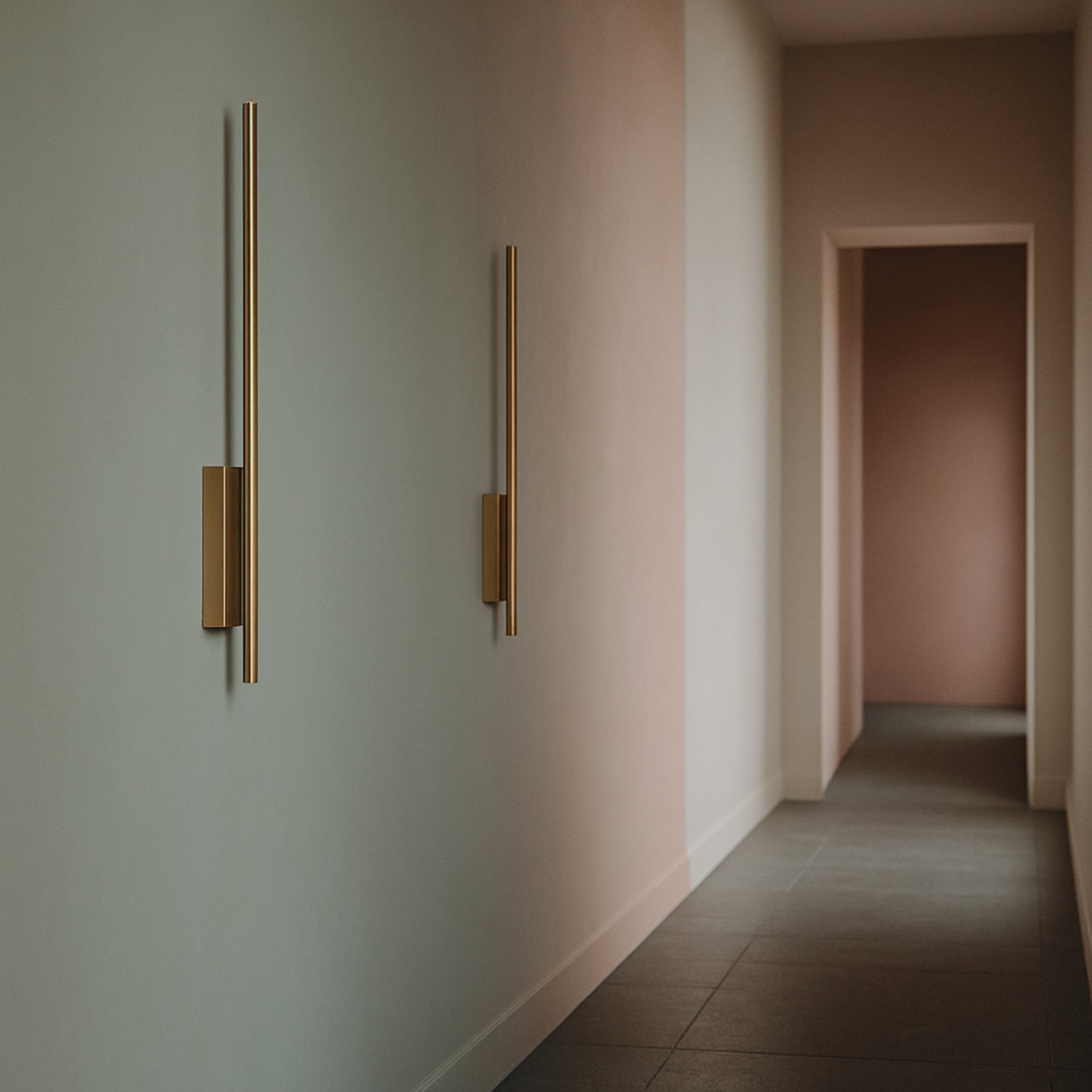 Northcut wall lamps from Love Hohm on a neutral-colored wall in a hallway