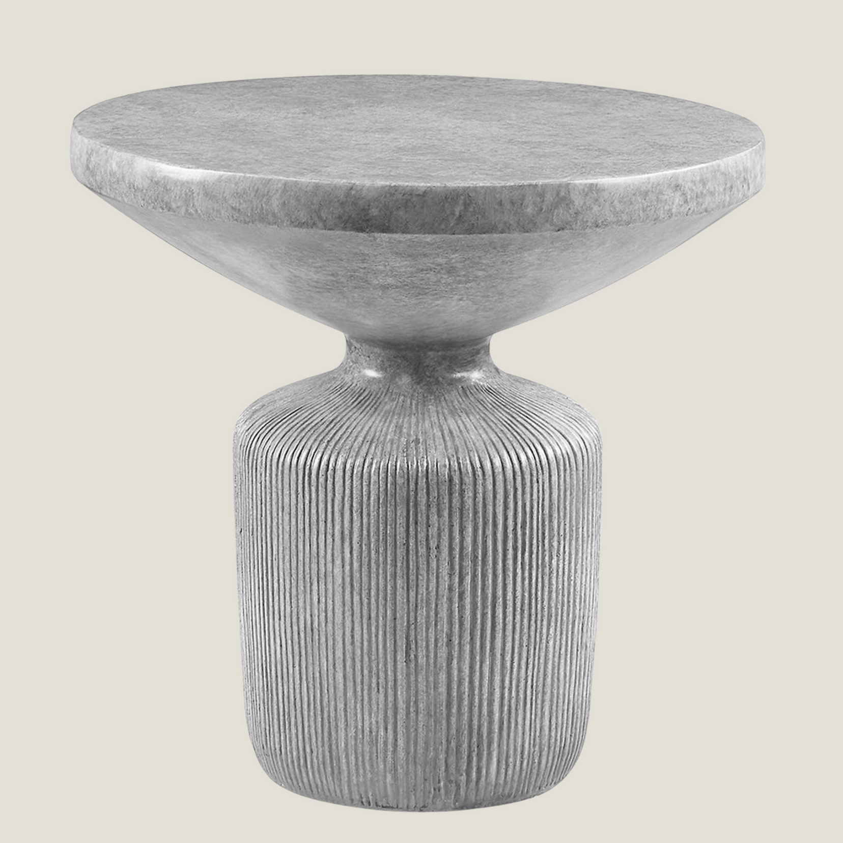 Oddurate gray cement side table from Love Hohm with ribbed cylindrical base on a light gray background