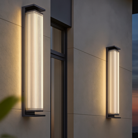 Pair of Sentinel outdoor wall lamps from Love Hohm against and sunset.