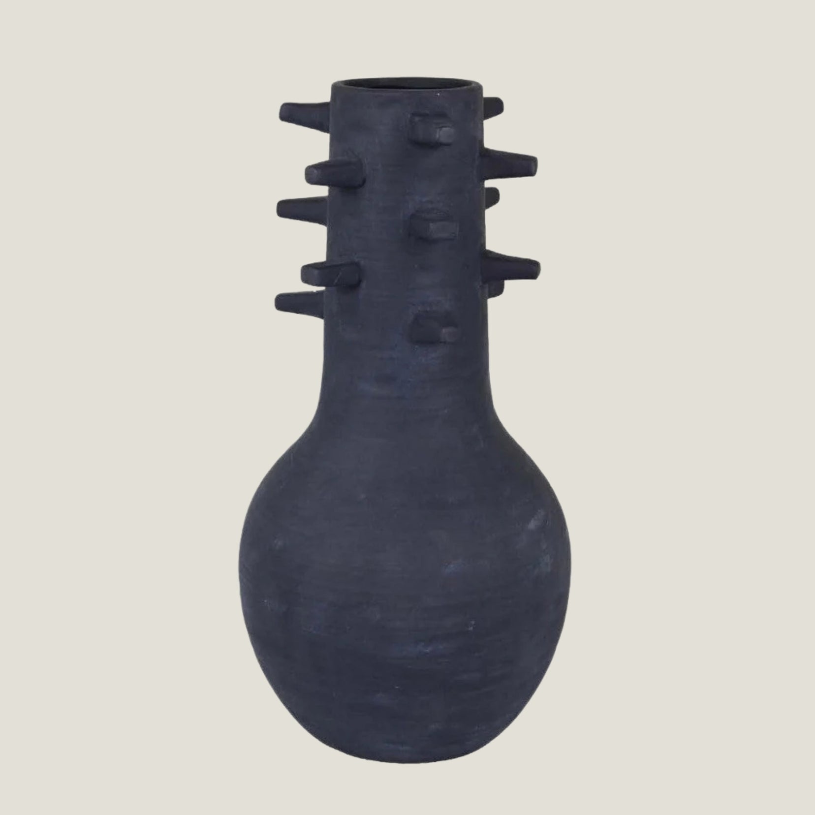 Spicula black textured vase from Love Hohm on a light beige background
