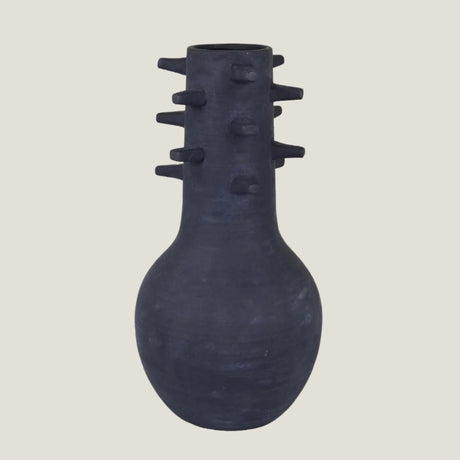Spicula black textured vase from Love Hohm on a light beige background