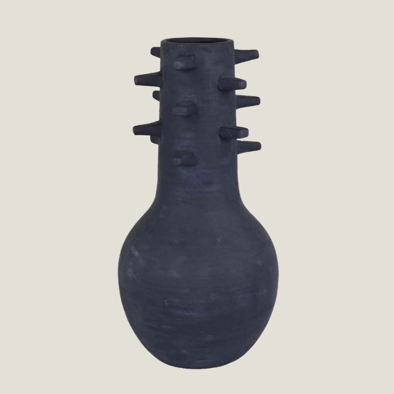 Spicula black textured vase from Love Hohm with spike-like protrusions on a light gray background