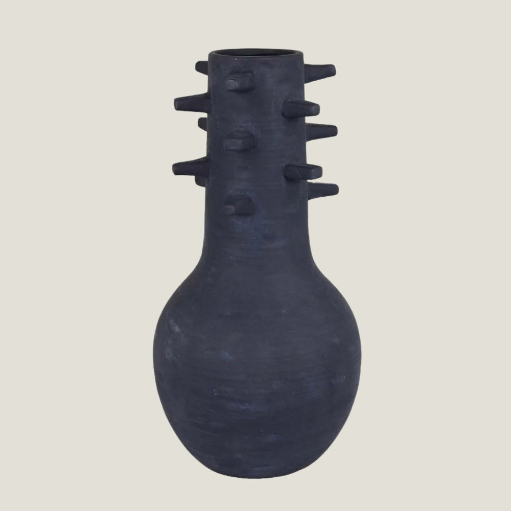Spicula black textured vase from Love Hohm with spike-like protrusions on a light gray background
