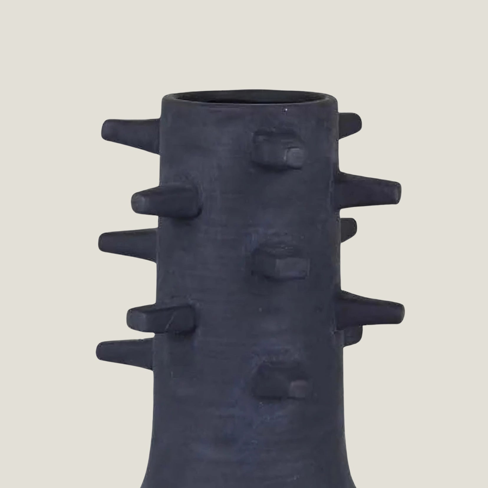 Spicula black textured vase from Love Hohm on a light beige background