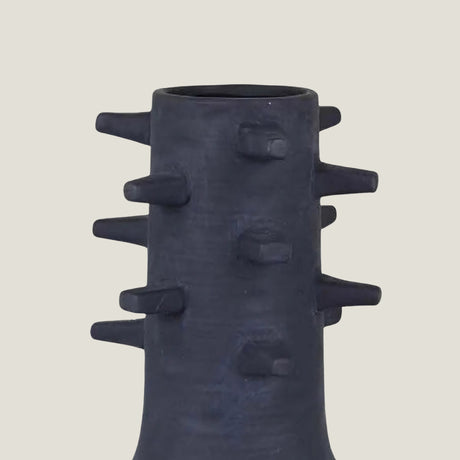 Spicula black textured vase from Love Hohm on a light beige background