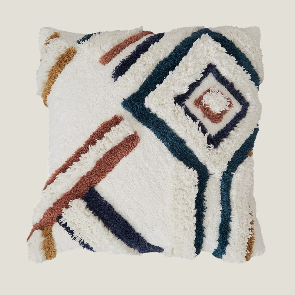 Stillwater decorative pillow from Love Hohm with geometric pattern on a beige background