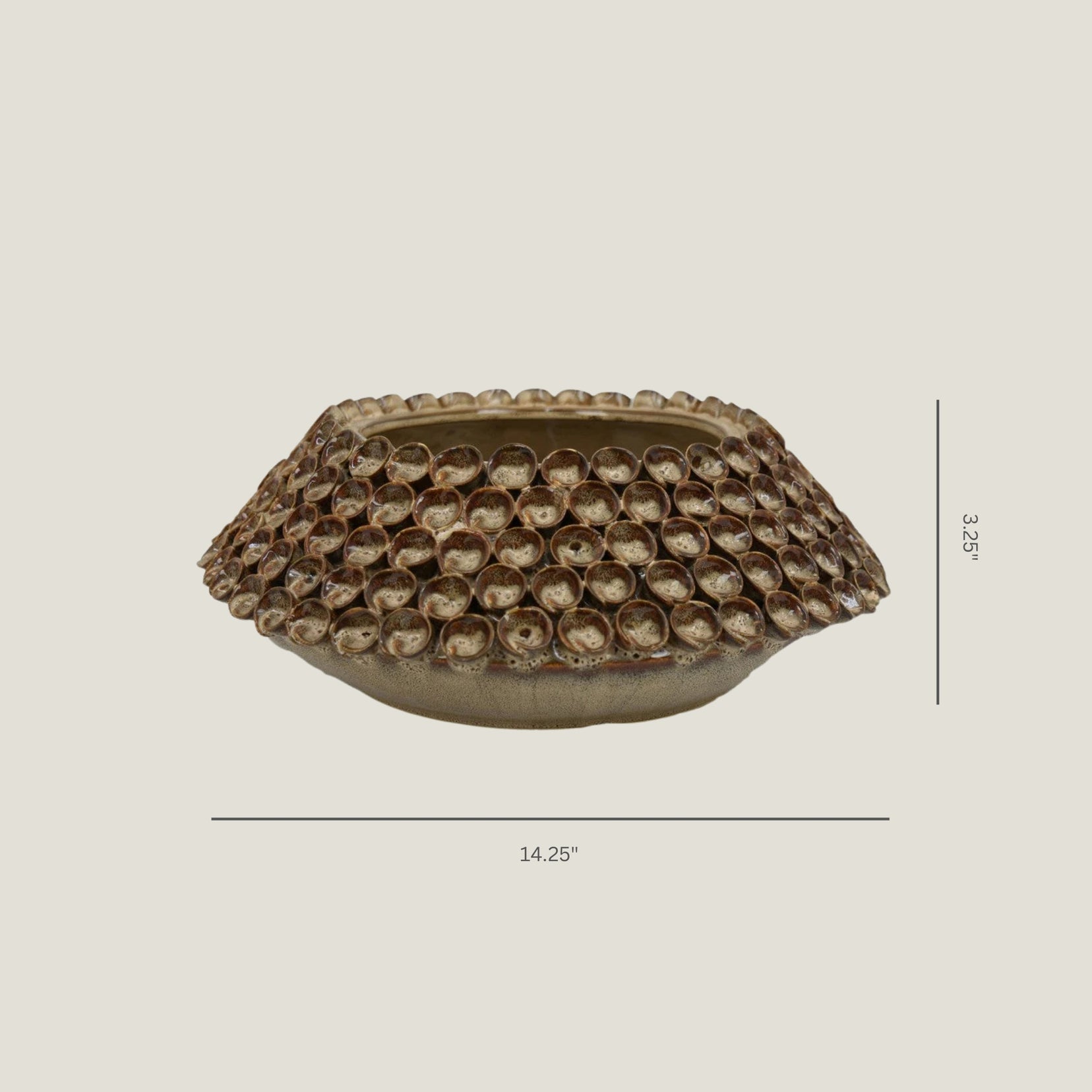 Thatch decorative ceramic bowl from Love Hohm with textured surface on a beige background