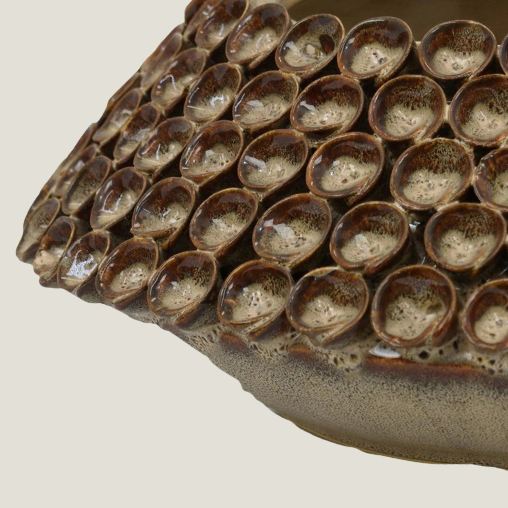 Thatch ceramic sculpture from Love Hohm with small cups on a beige background