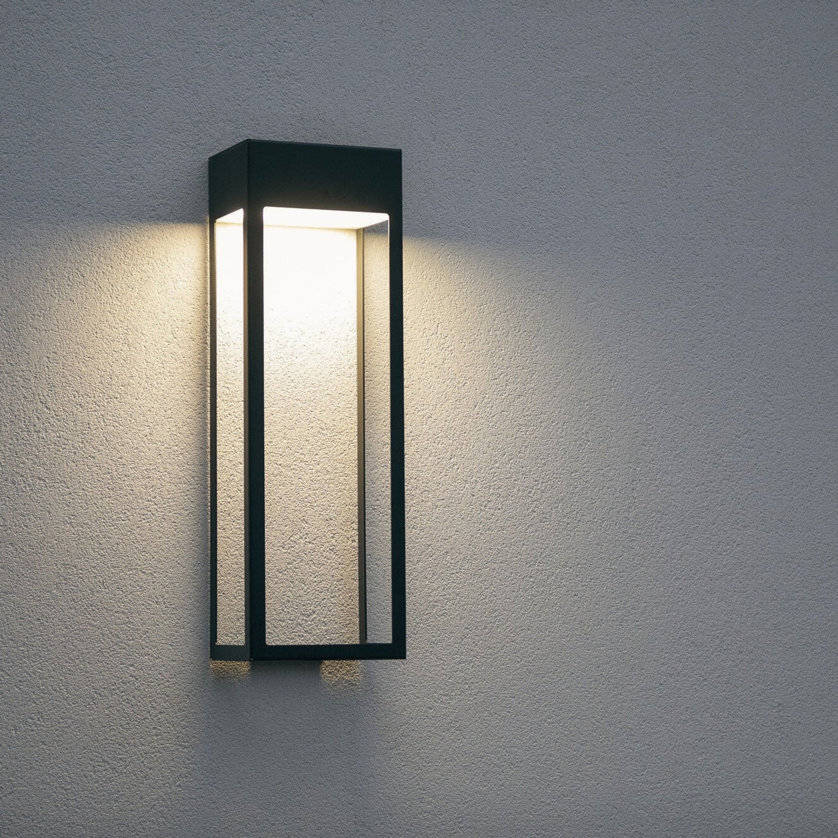 Threshold outdoor wall light from Love Hohm on a textured gray wall