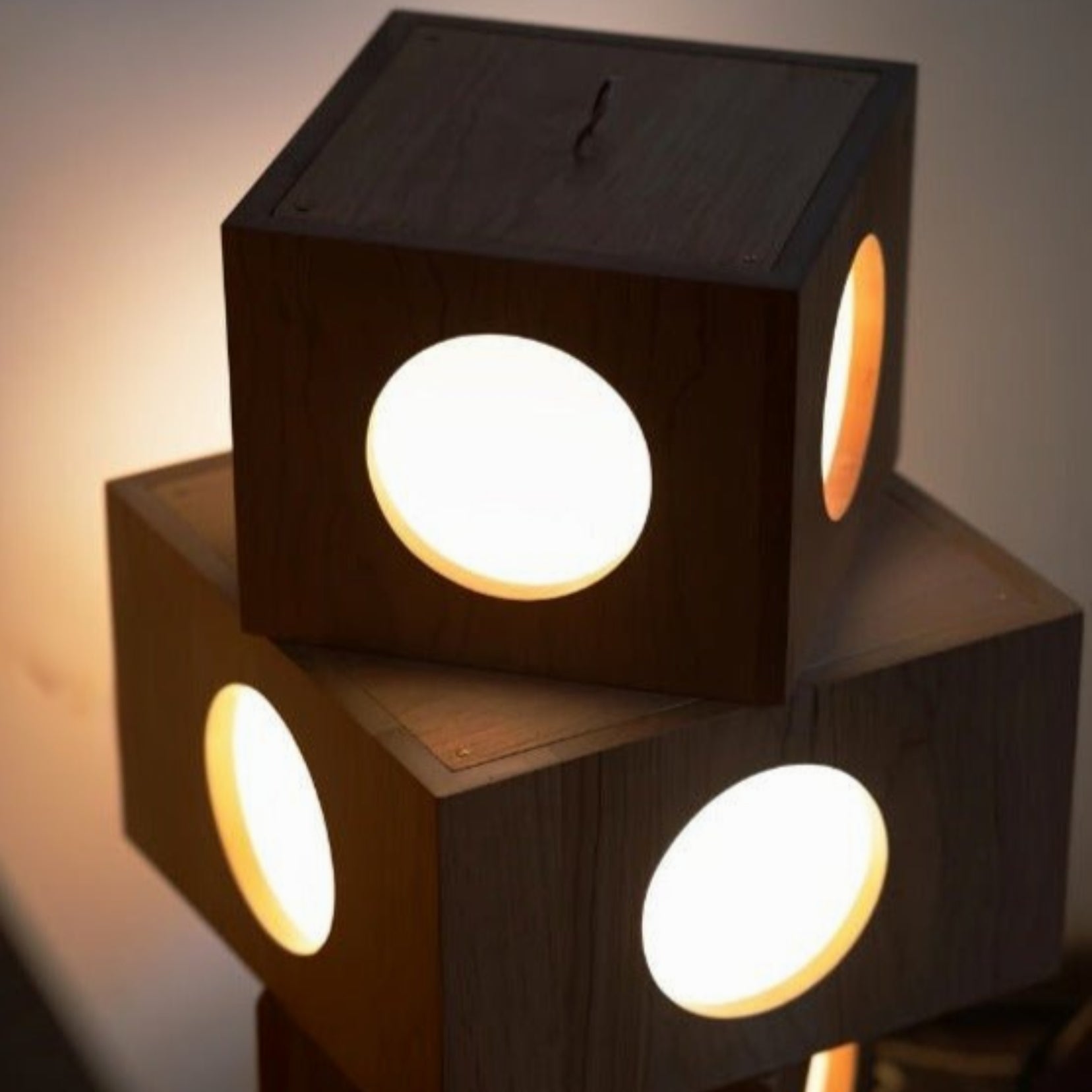 Torii floor lamp from Love Hohm with circular cutouts glowing softly