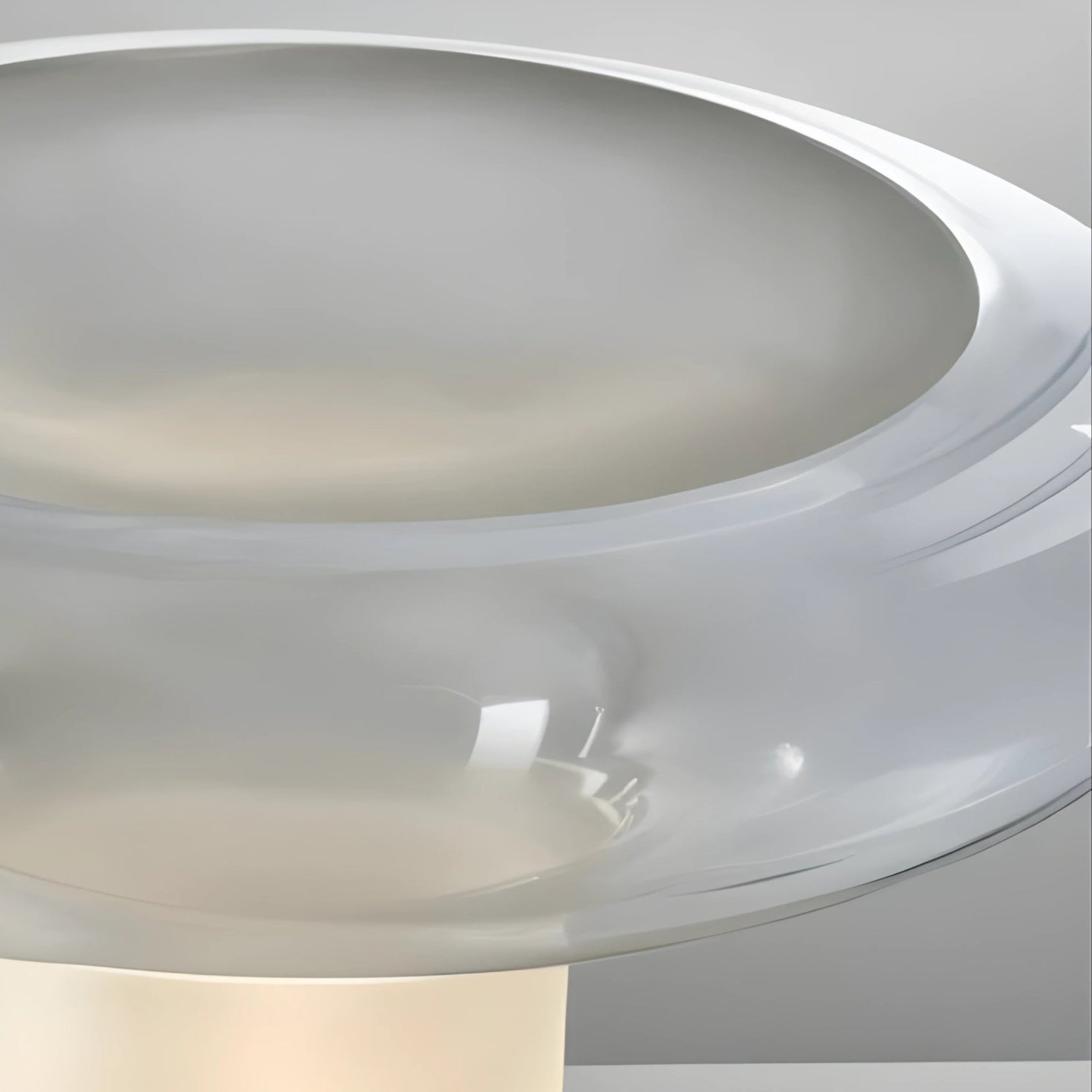 Close-up of a Vault table lamp from Love Hohm with a white finish.