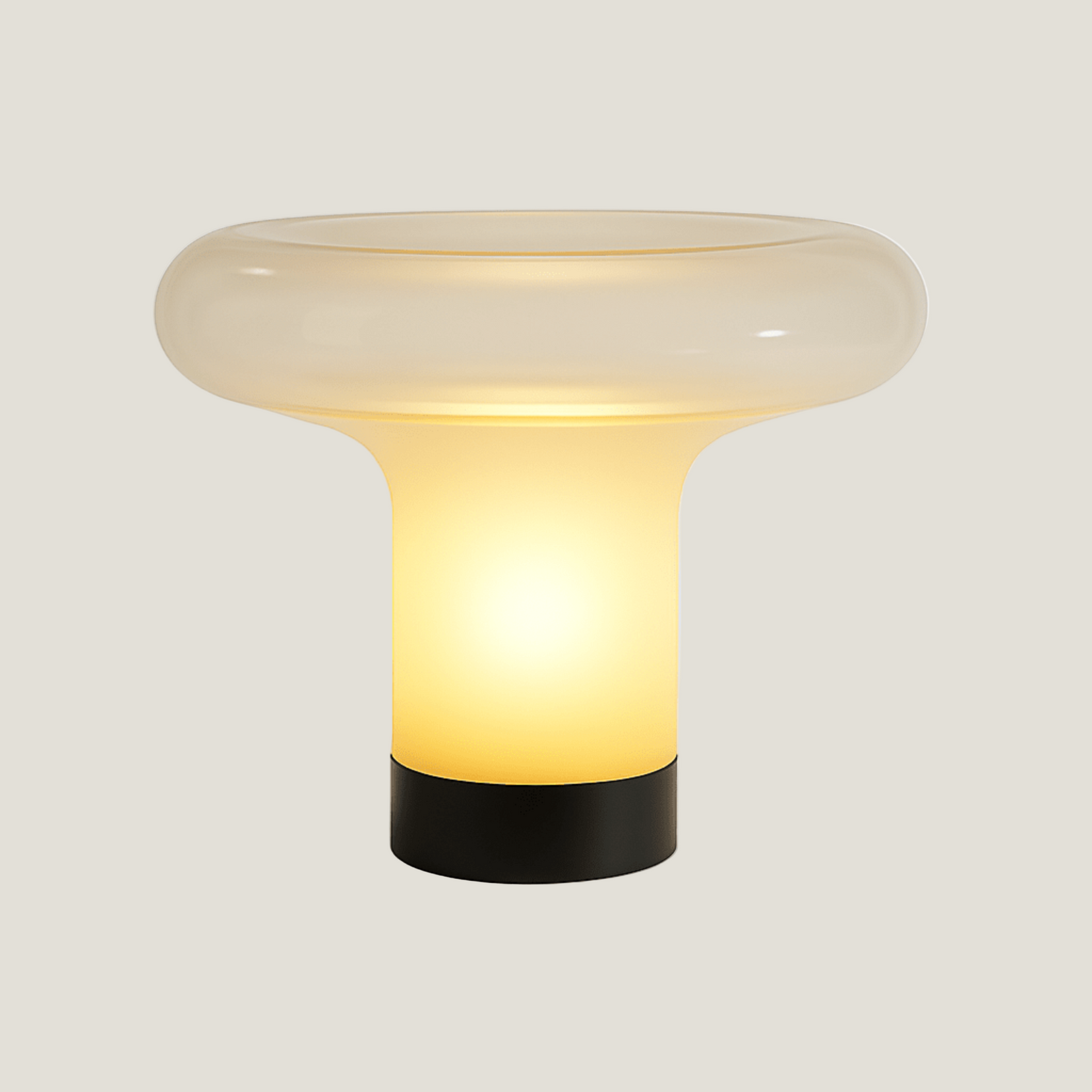 Vault table lamp from Love Hohm with a glass shade and black base on a light gray background