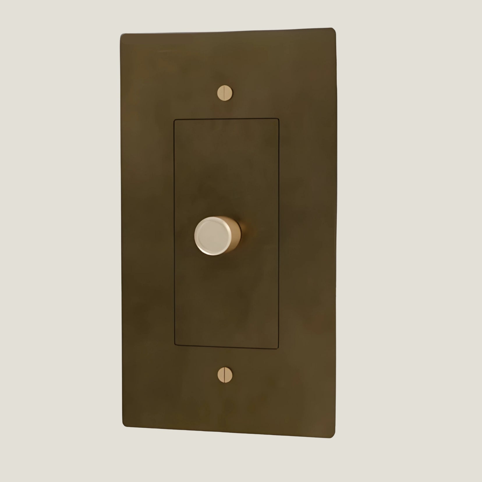 Verge brass dimmer from Love Hohm with a gold knob on a beige background