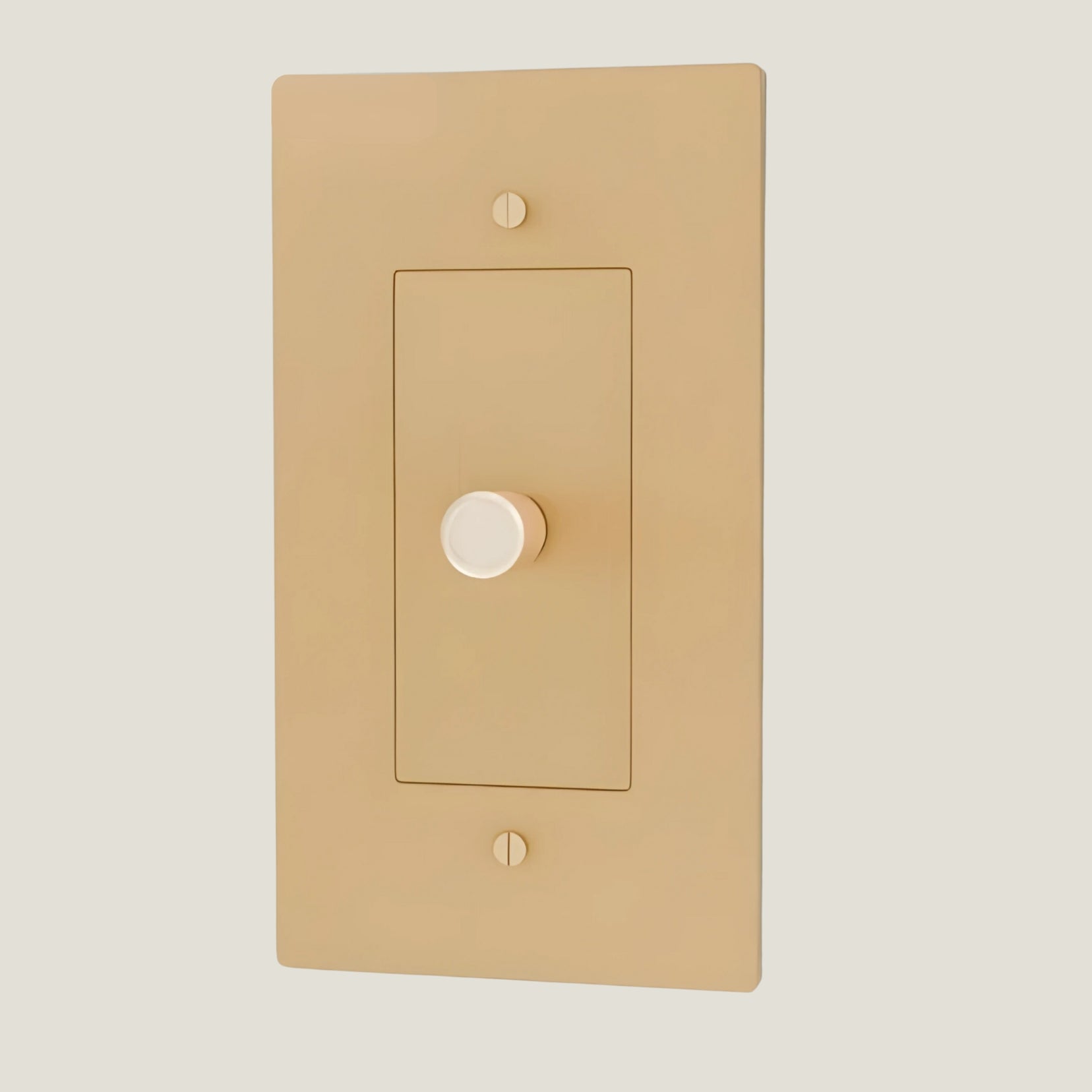 Verge brass dimmer by Love Hohm with a brass center on a light gray background