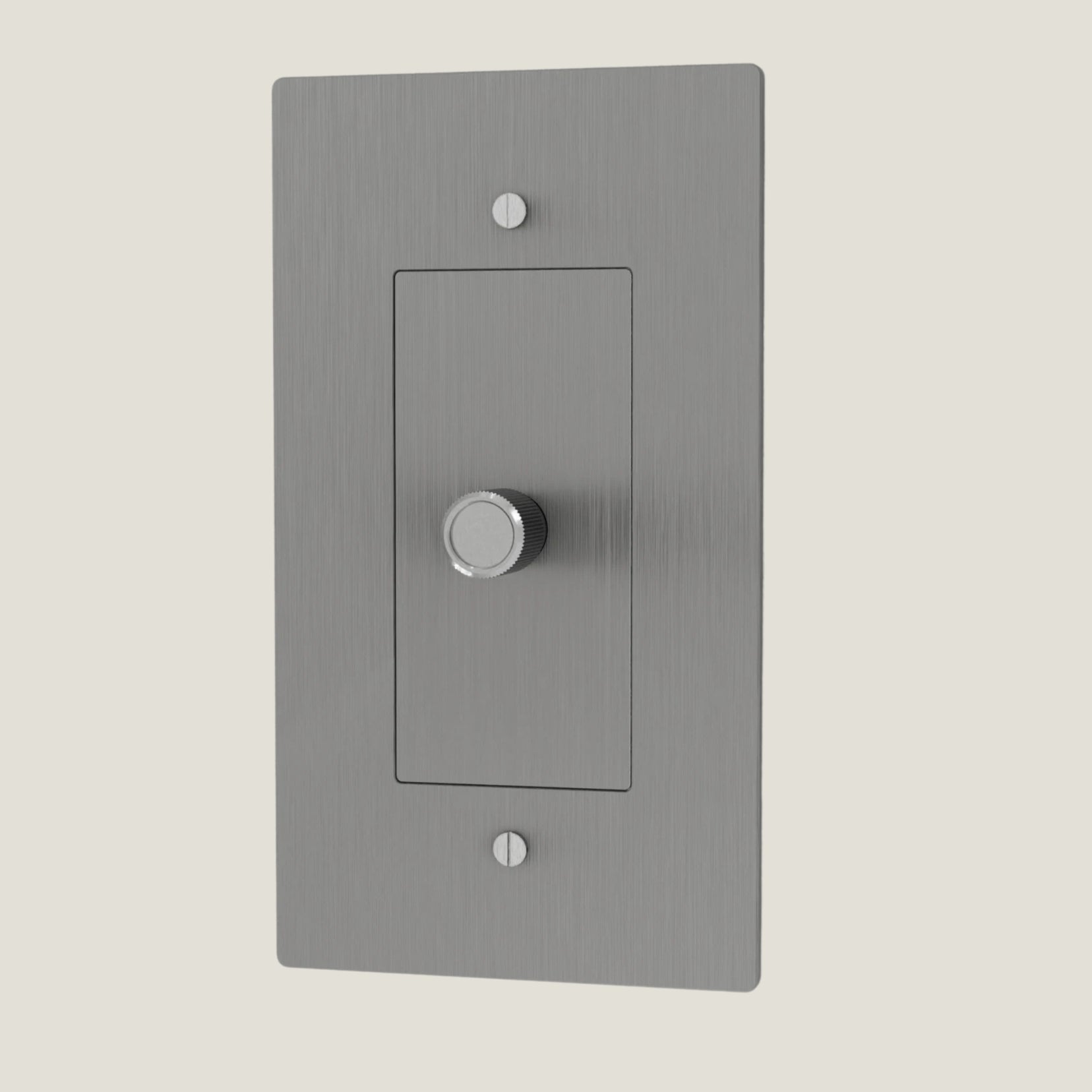 Verge brass dimmer from Love Hohm with a central rotary knob on a light gray background